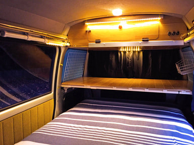 Subaru Classic campervan bed in night