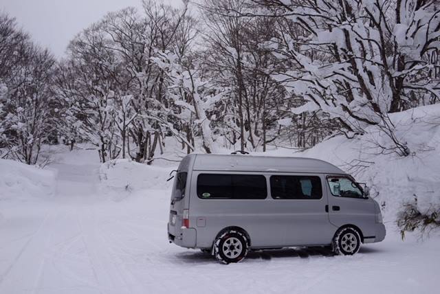 snowy mountains and campervan